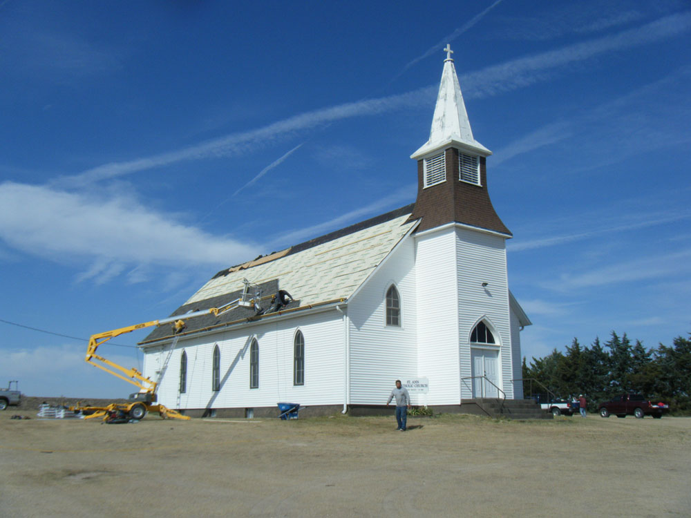 Roofing work on a church shown in the original project gallery